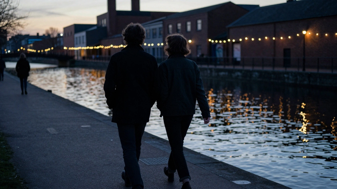 A person and companion walking peacefully along Hackney Wick canals at dusk, soft reflections on water.