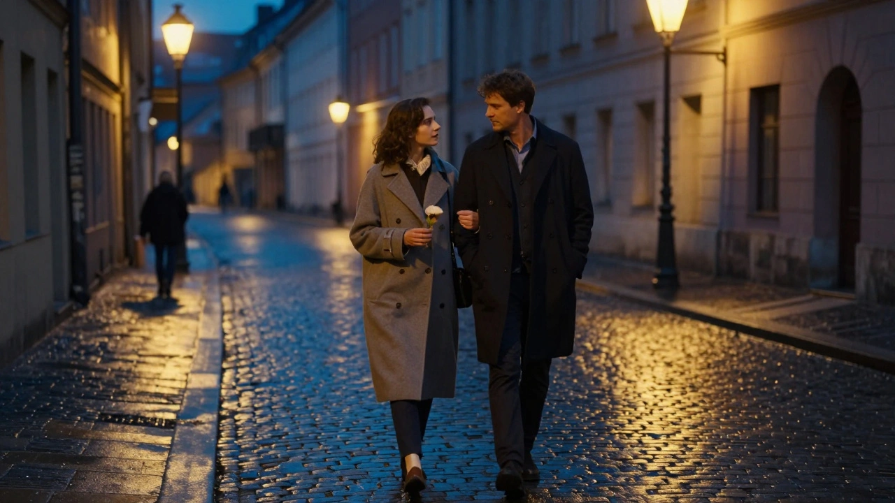 A petite woman and man walking peacefully at night, streetlights glowing on wet pavement.