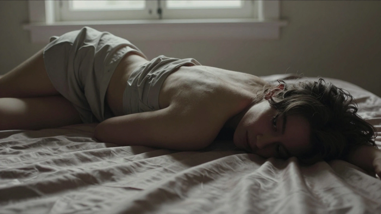 Person rolling on silk sheets, glancing over shoulder, hair falling, light catching curve of body and shifting fabric.