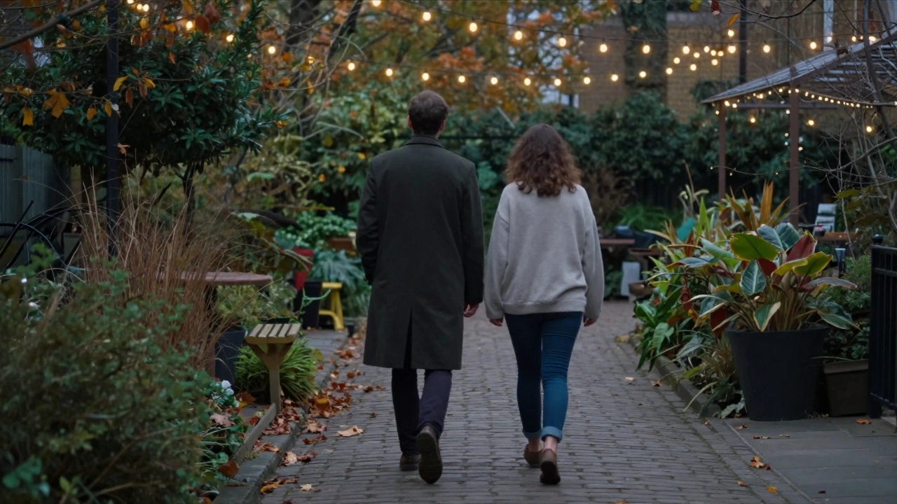 Two individuals walk silently through a hidden London garden at dusk, radiating calm and mutual comfort.