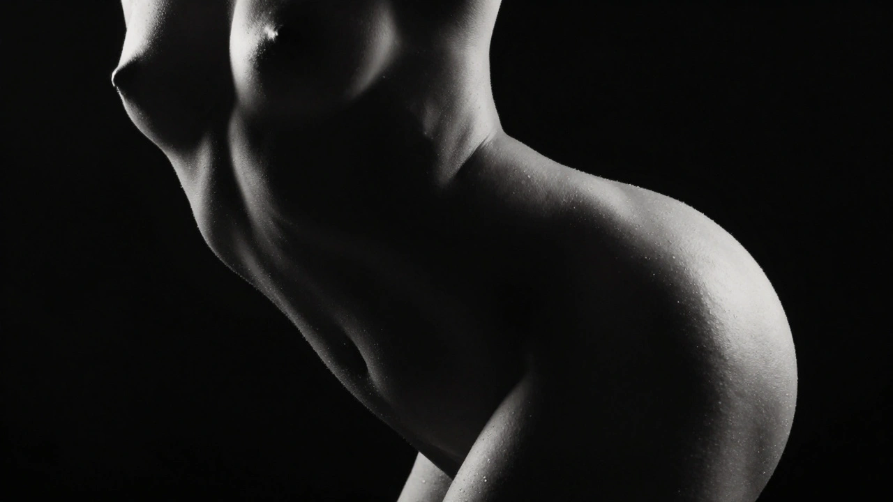 High-contrast black and white artistic photo showing the sculptural curves of a human silhouette